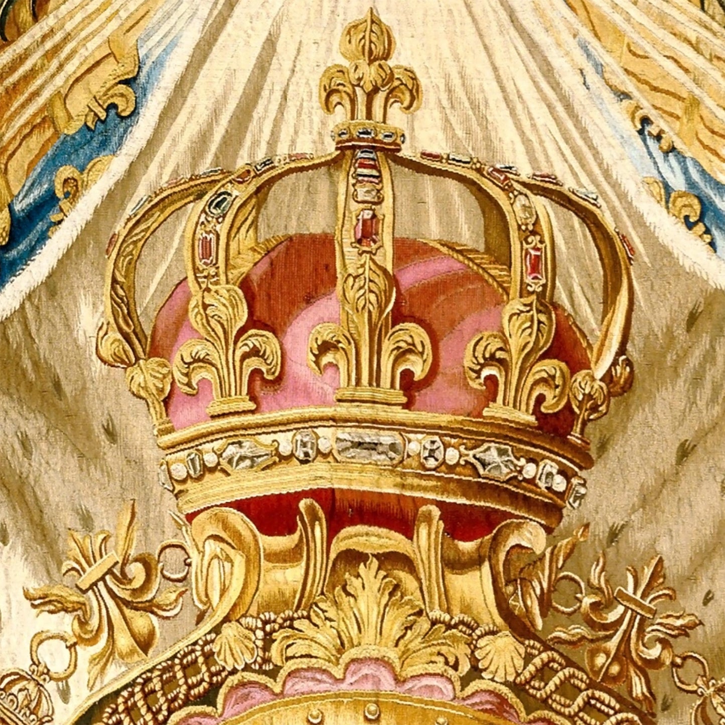 Close-up of the golden royal crown with red velvet lining from The Arms of Louis XV tapestry.