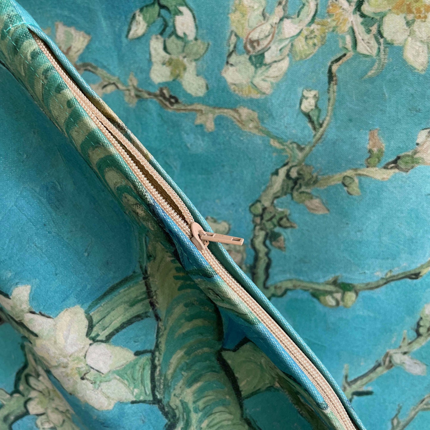 Detail of zipper in cream color for the Almond Blossom throw pillow cover