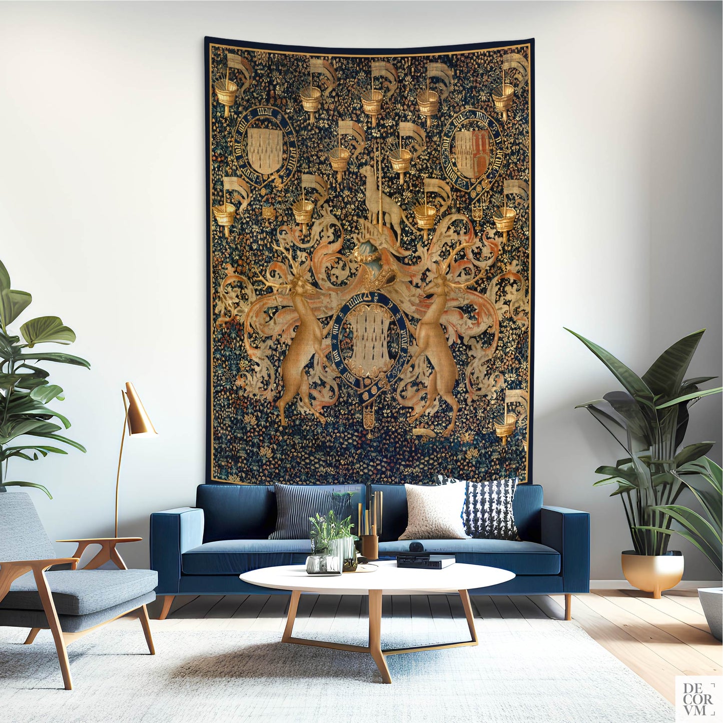Armorial wall tapestry featuring heraldic motifs and lions, hanging in a modern living room with navy blue sofa.