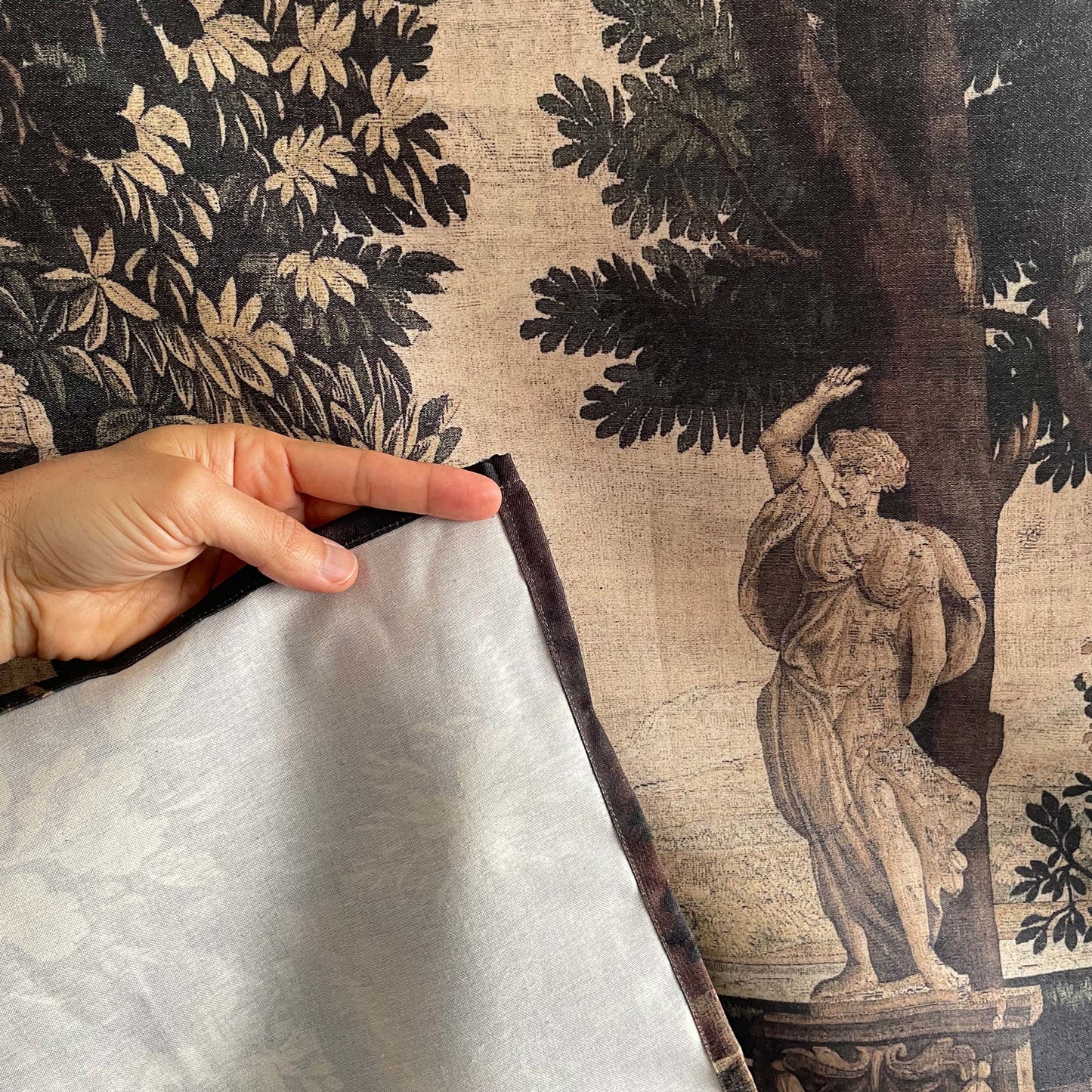 Forest and River wall hanging fabric detail of a statue and the fabric on the back
