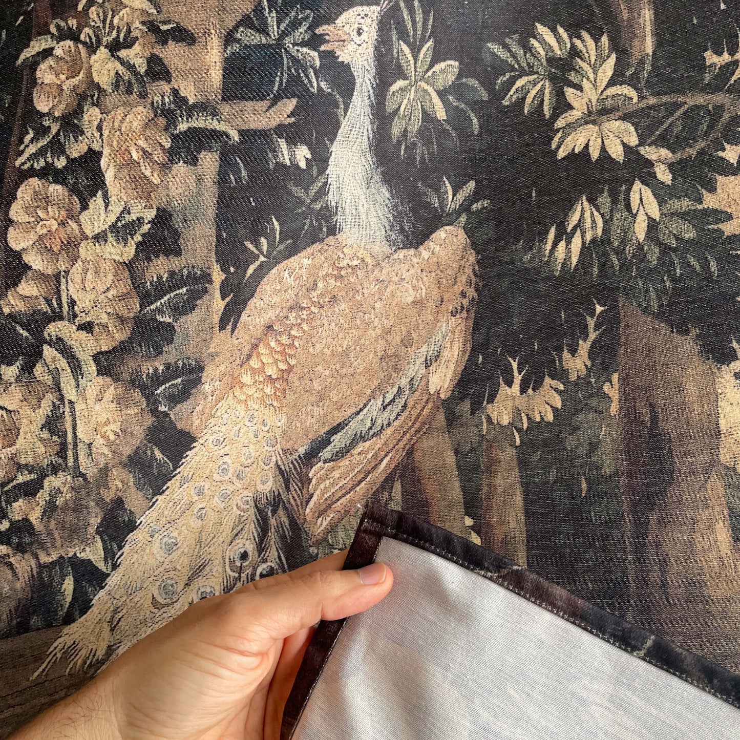 Forest and River wall hanging fabric detail of a bird and the fabric on the back