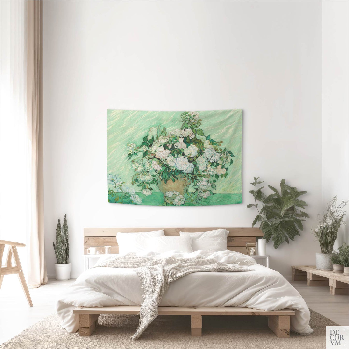 Small-size wall tapestry with Van Gogh’s vase of roses artwork in a serene bedroom setting with white walls and plants.