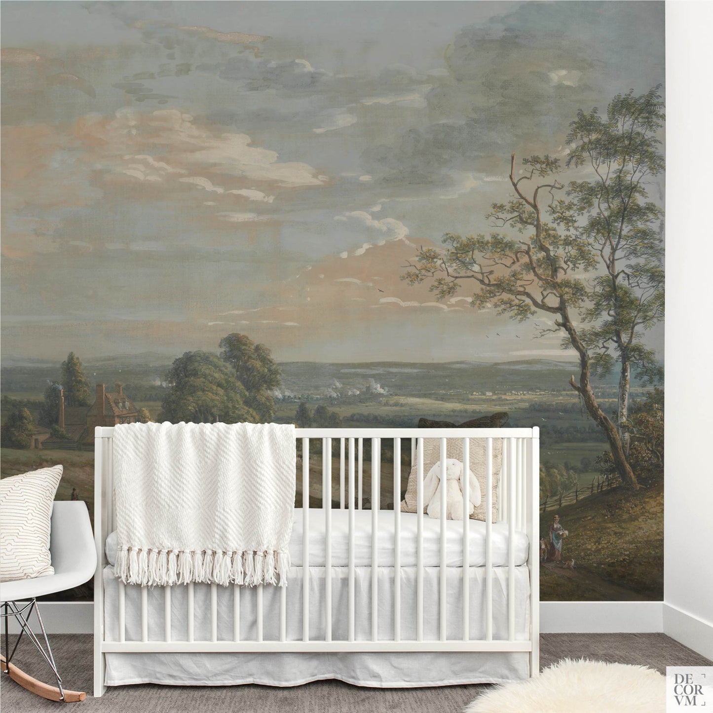 Nursery decorated with mural of a peaceful English rural scene showing shepherds, a country house, and open sky, by Decorvm.