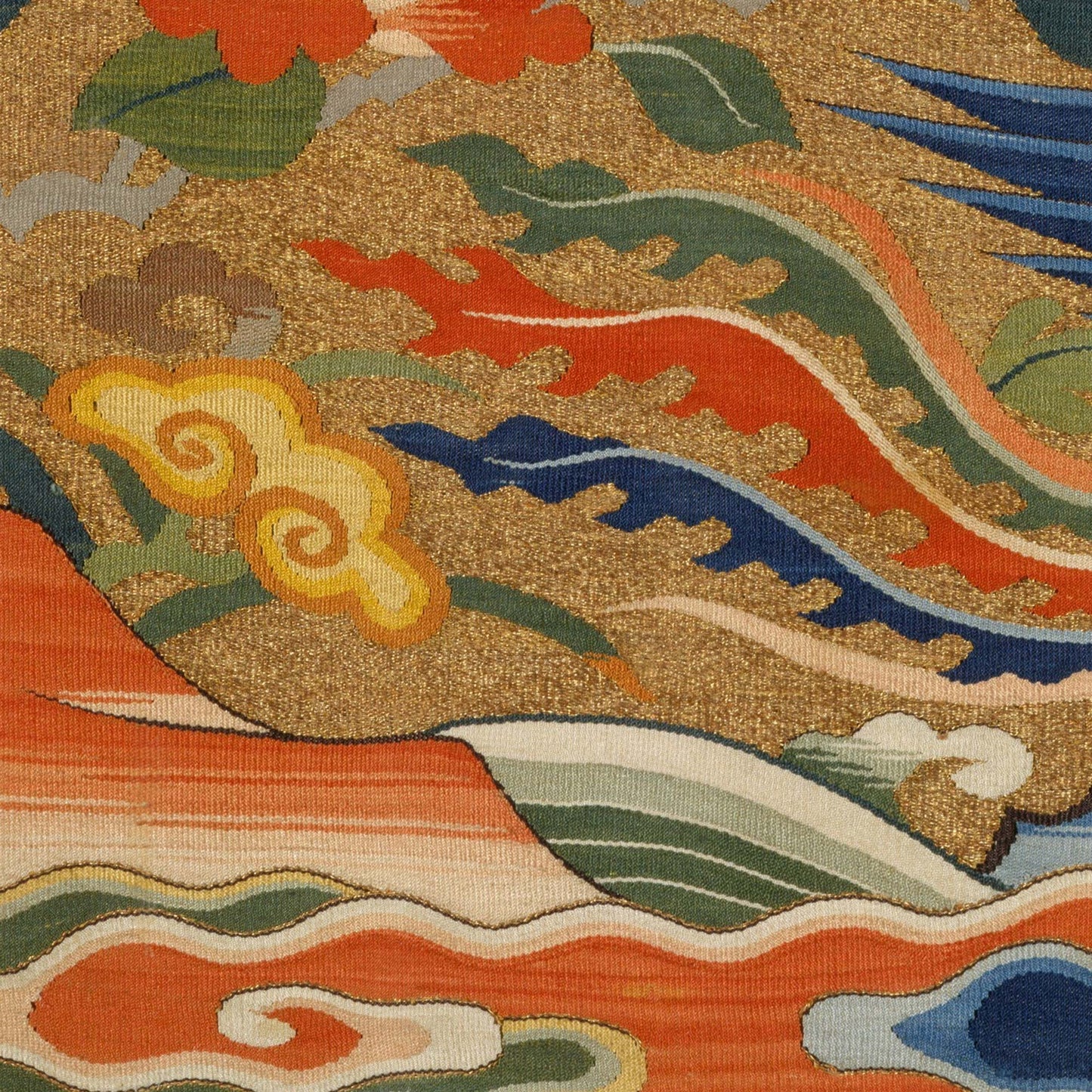 Stylized waves and ruyi clouds in coral, jade, and indigo with flame-like scrolls—close-up of Chinese phoenix rank badge textile.