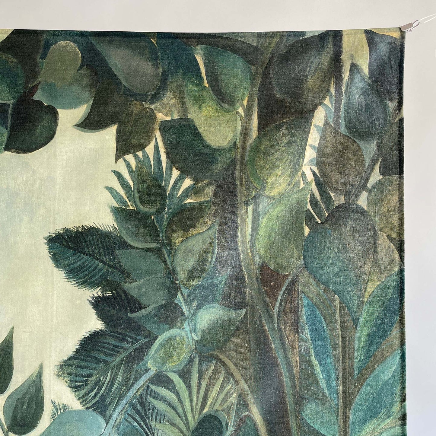 Close-up of Rousseau Equatorial Jungle tapestry showing detailed tropical foliage and green botanical textures.