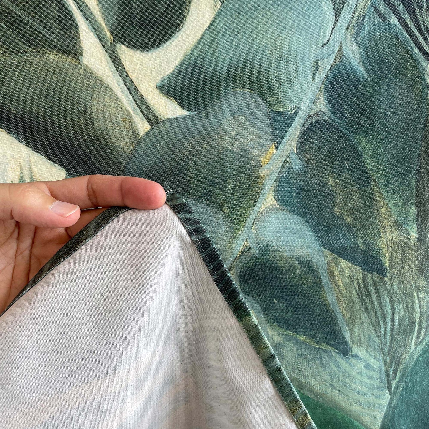 Detail of tapestry fabric with Rousseau Equatorial Jungle print, showing texture and quality of cotton blend textile.