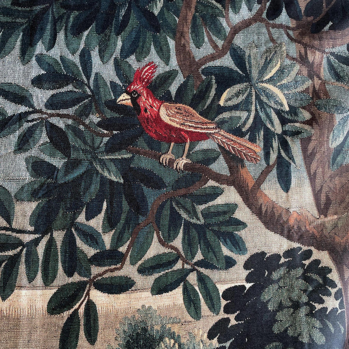Verdure Chateau Garden tapestry close-up of northern cardinal bird, woven foliage and blush roses, highlighting texture and color.