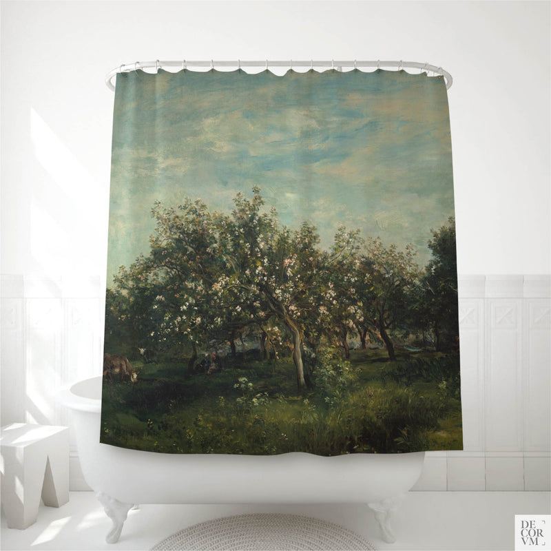 Apple blossom orchard shower curtain hung over a white clawfoot tub in a bright bathroom — an 1873 Daubigny French spring landscape printed on soft cream fabric by Decorvm.