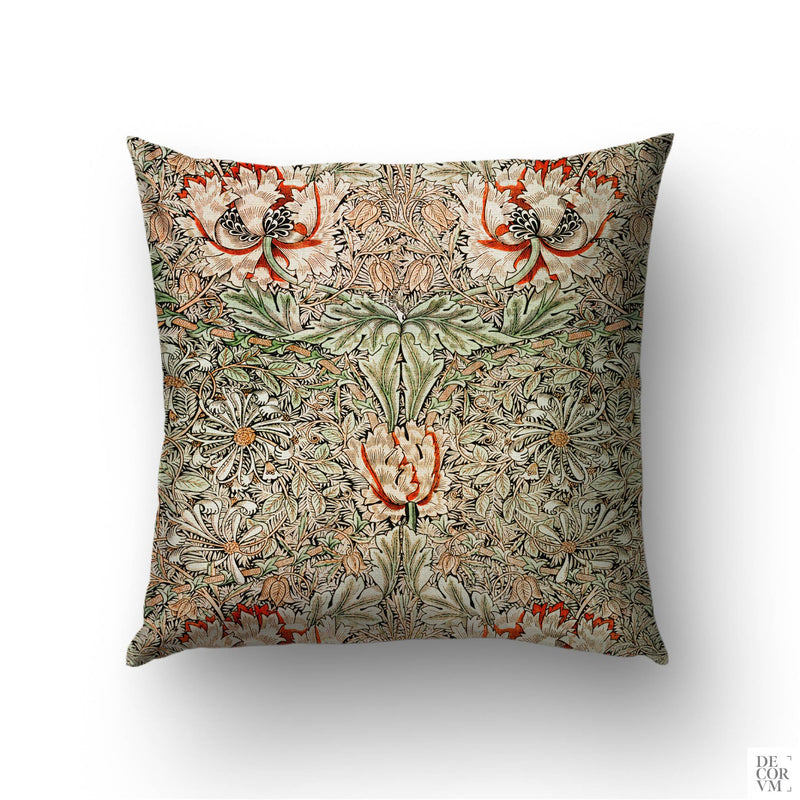 May Morris Honeysuckle throw pillow cover on a sofa — 1883 Arts and Crafts pattern in orange, cream, and green by Decorvm.