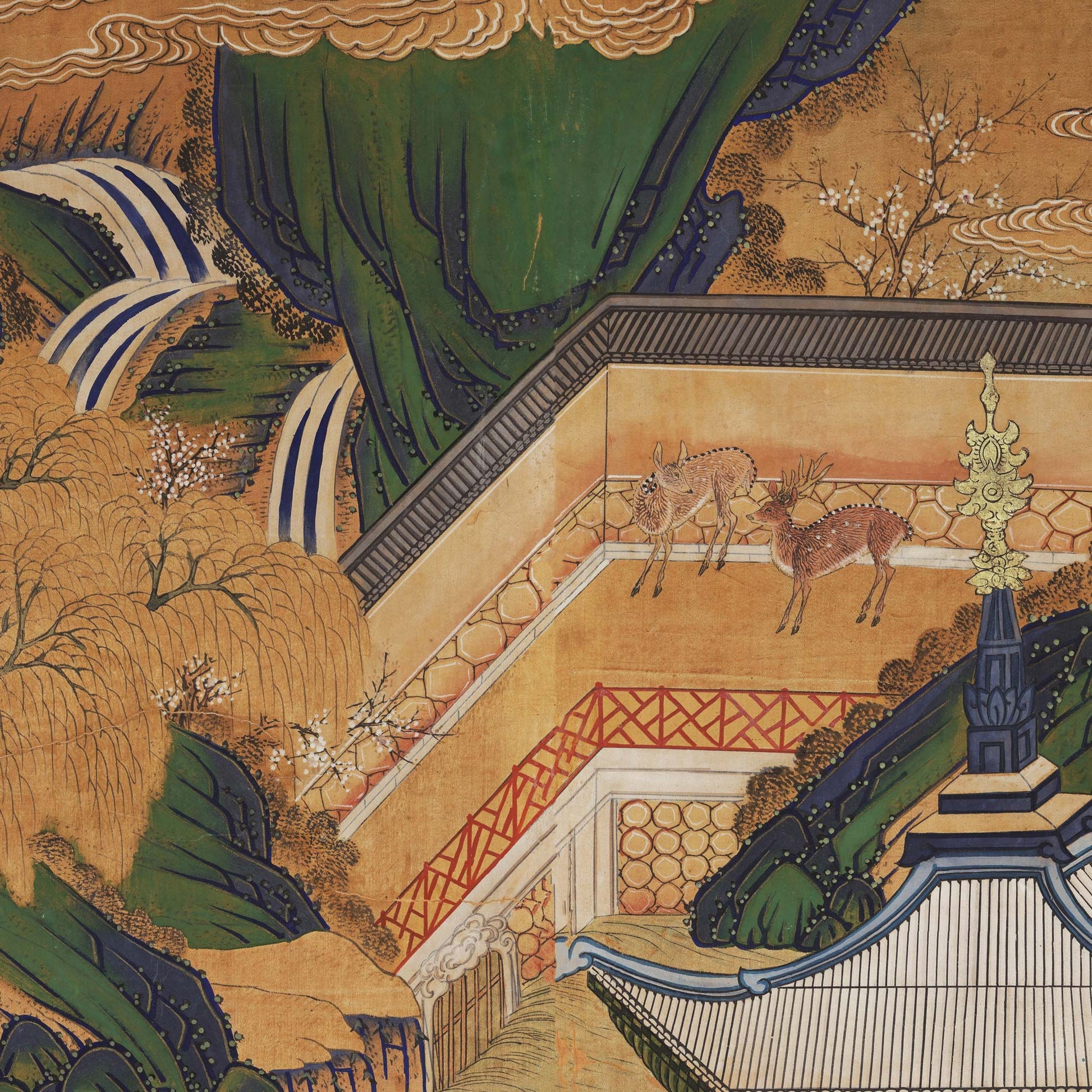 Close up view of two deer standing in a walled garden courtyard next to a stylized waterfall and weeping willow tree.