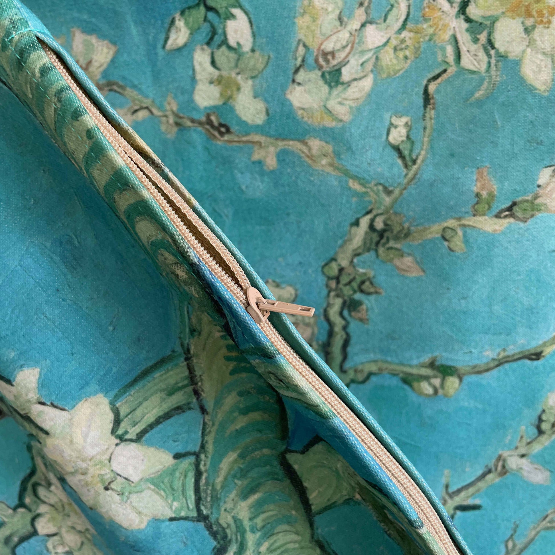 Detail of zipper in cream color for the Almond Blossom throw pillow cover
