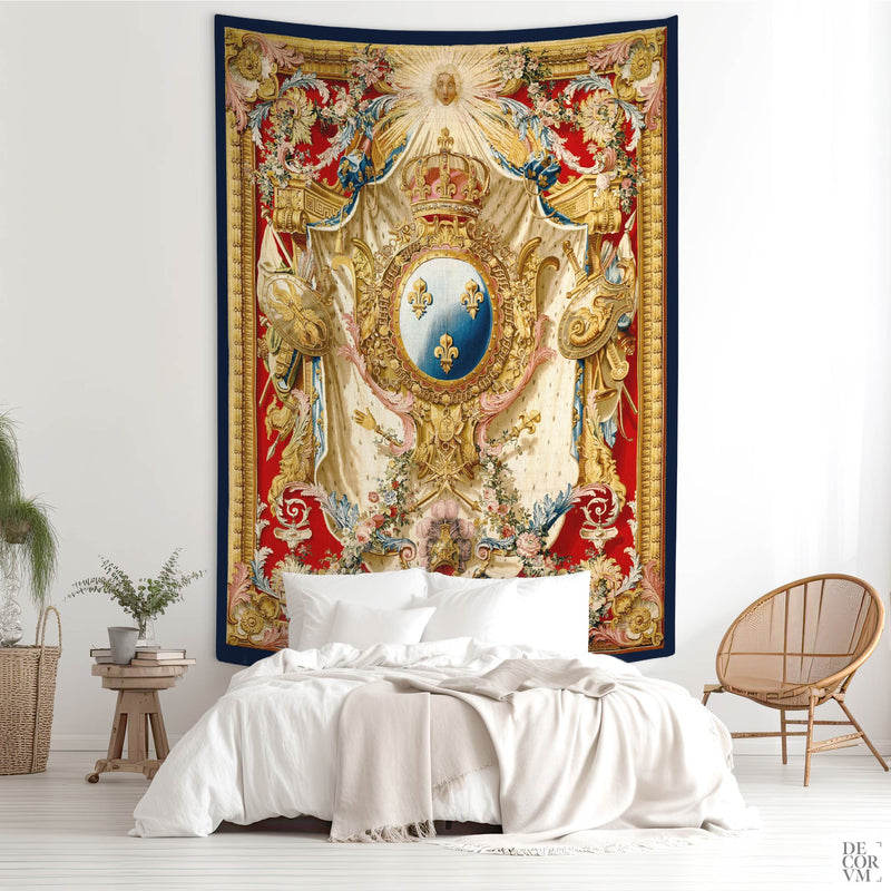 The Arms of Louis XV wall tapestry hung above a white bed in a calm bohemian bedroom with neutral and natural decor.