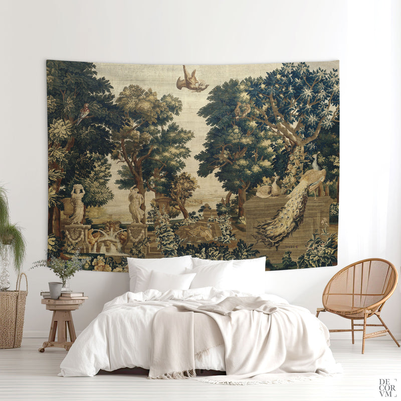 Large French verdure tapestry with peacock, fountain, and forest scenery hung above a bed in a calm bedroom.