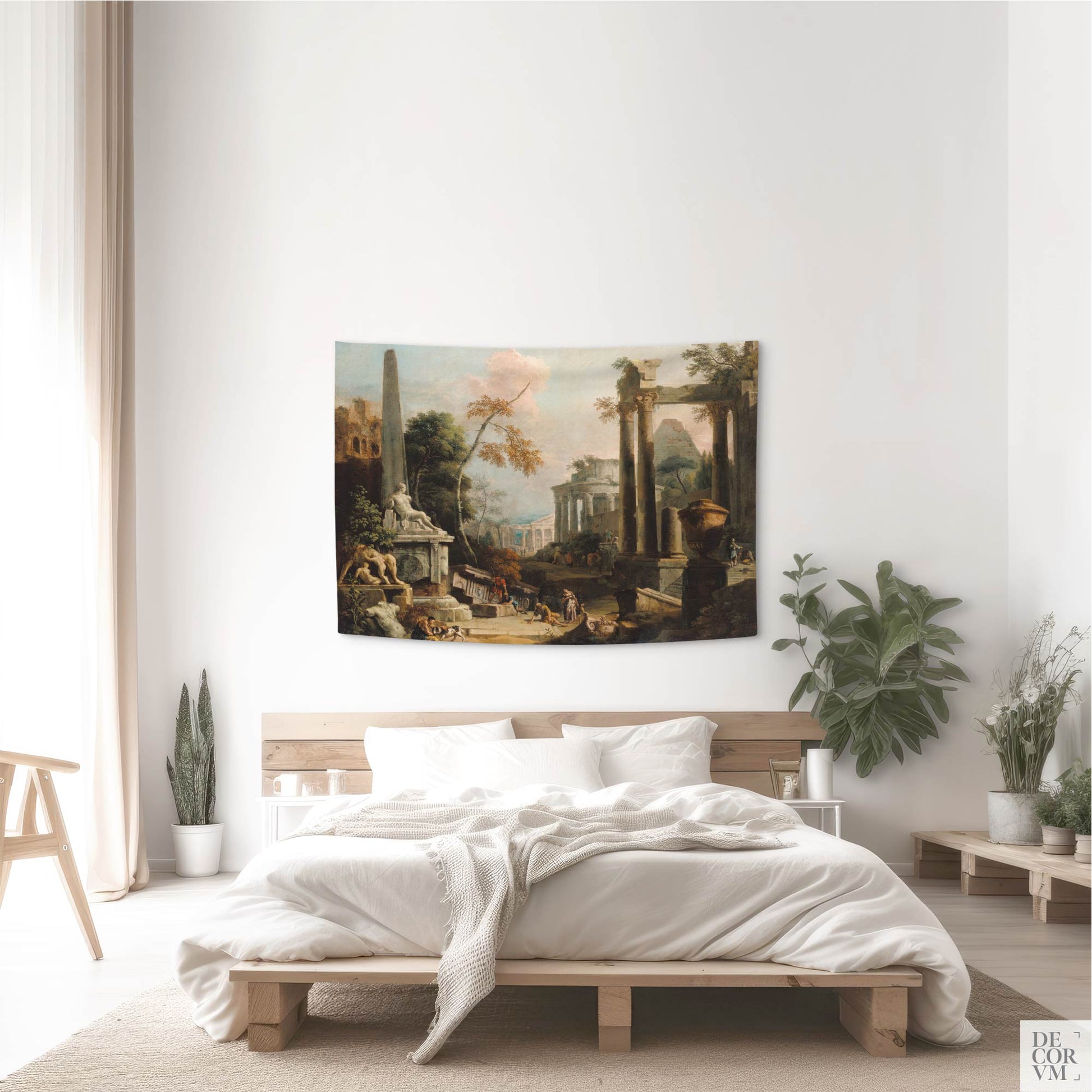 Small-sized wall tapestry depicting classical ruins, displayed in a bright bedroom with indoor plants and natural light.