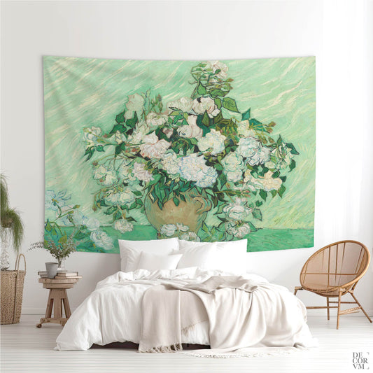 Wall tapestry with Van Gogh's “Roses” artwork hanging above a white bed in a bright, modern bedroom with natural decor.