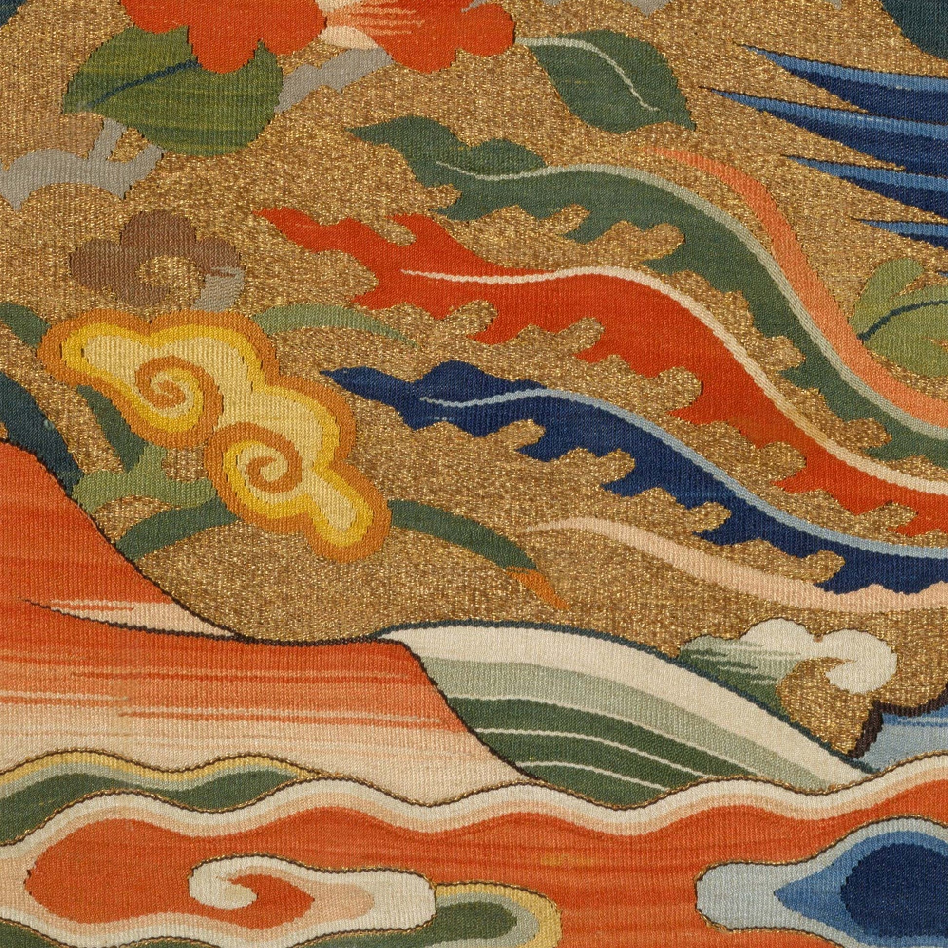 Stylized waves and ruyi clouds in coral, jade, and indigo with flame-like scrolls—close-up of Chinese phoenix rank badge textile.