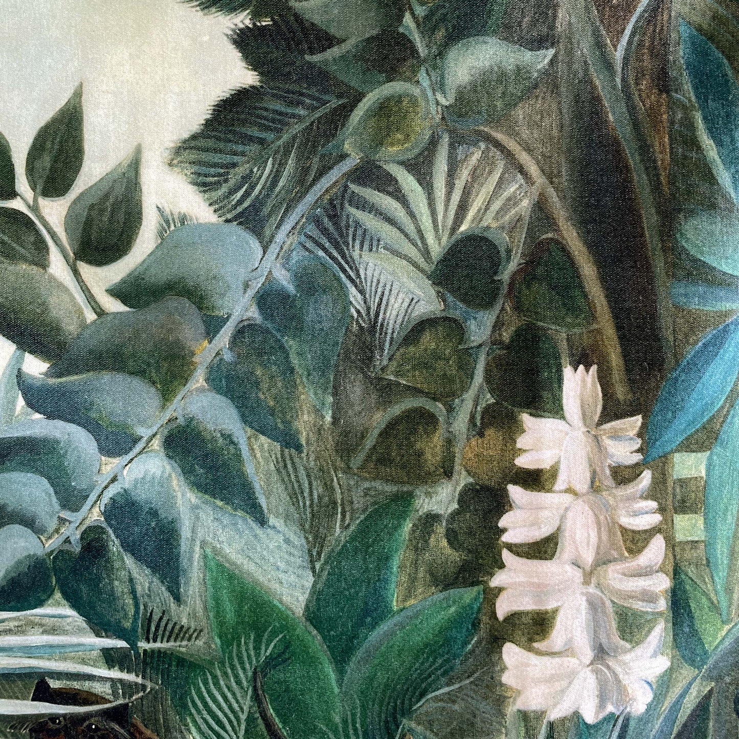 Maximalist greenery detail of the Henri Rousseau Equatorial Jungle cushion cover, featuring rich emerald foliage, intricate vines, and elegant white blooms.