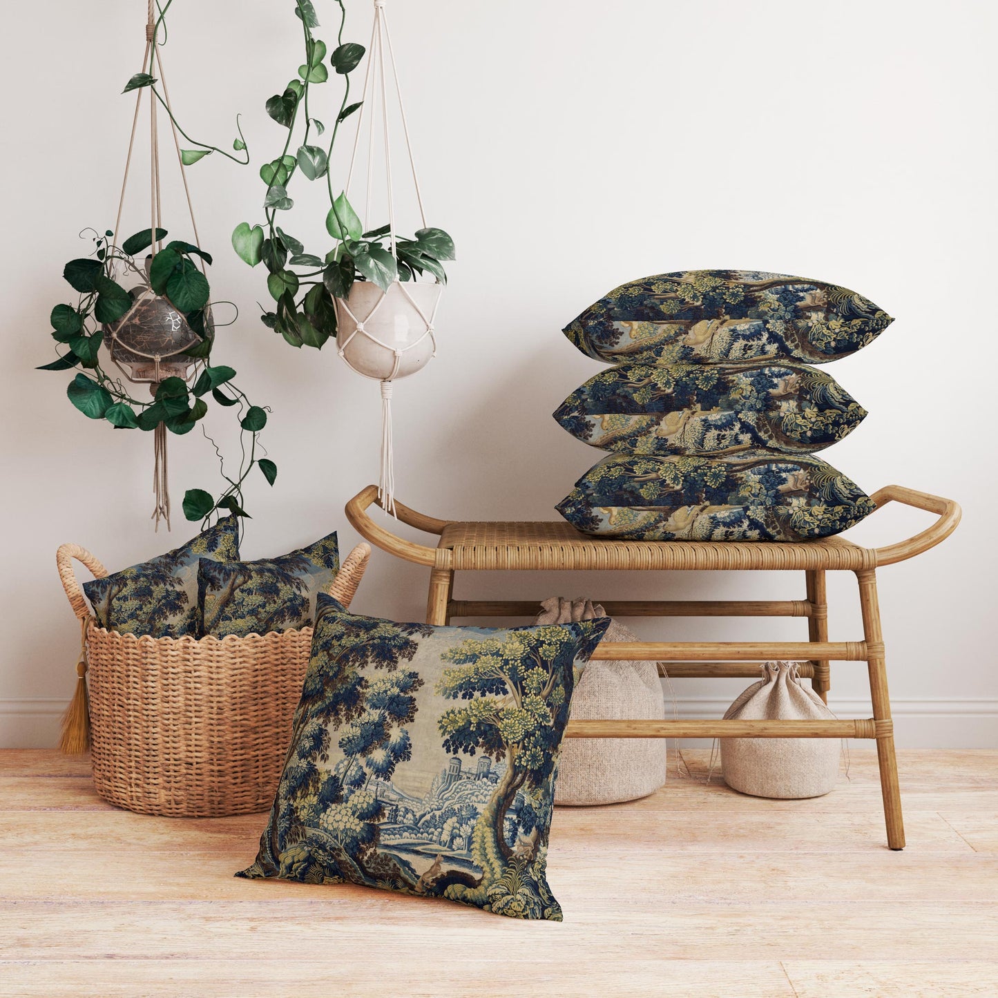 Stacked medieval forest tapestry cushions on rattan bench with plants vintage reproduction by Decorvm