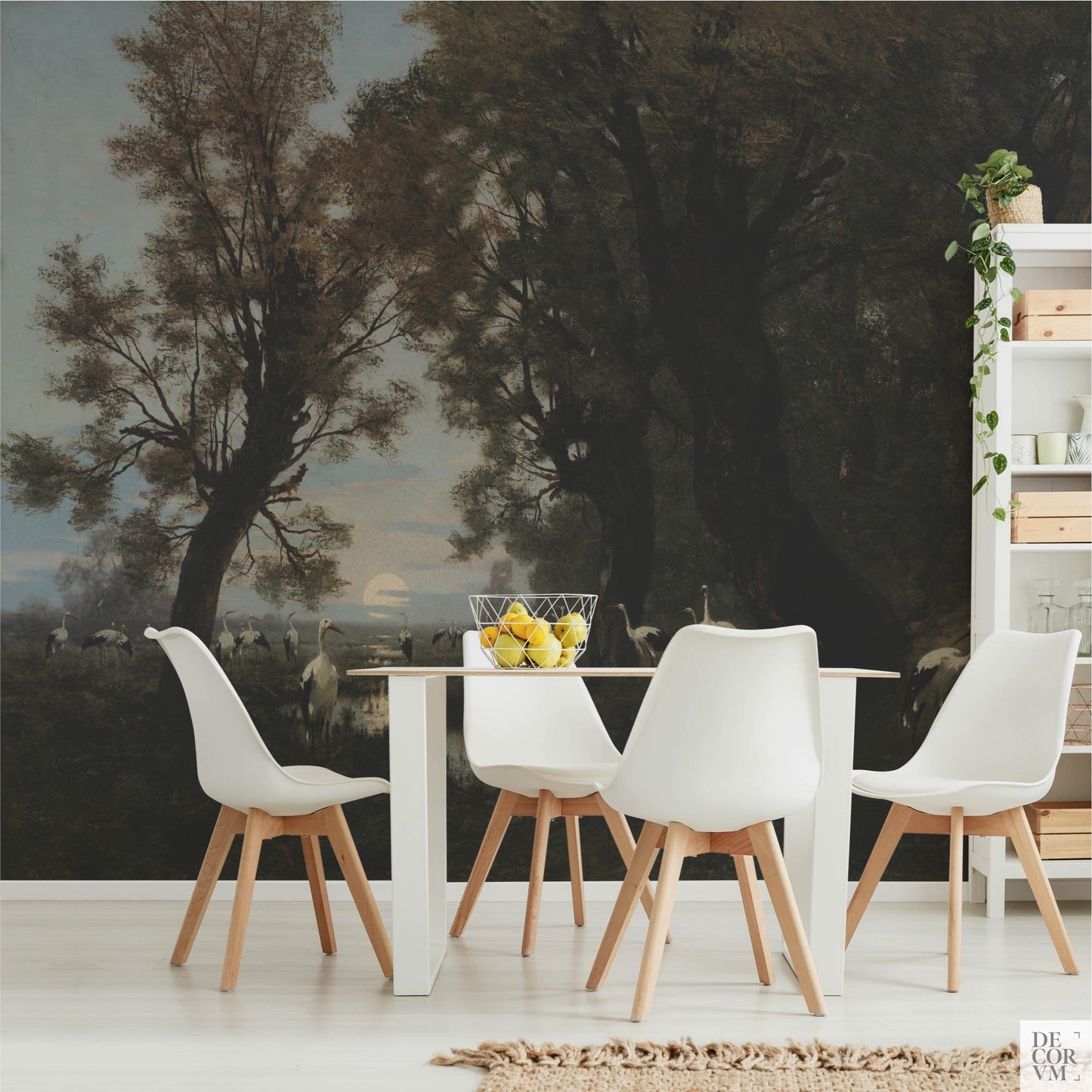 Dining room mockup featuring the Gathering Storks wallpaper mural on the wall behind a white table and Scandinavian-style chairs.