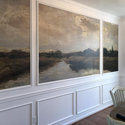 Dutch river landscape wallpaper mural in a dining room — vintage oil painting installed within multiple wall moulding panels