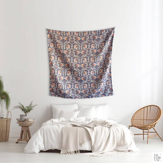 William Morris Pimpernel woven jacquard wall tapestry above a bed; navy, rust and ivory Arts and Crafts floral.