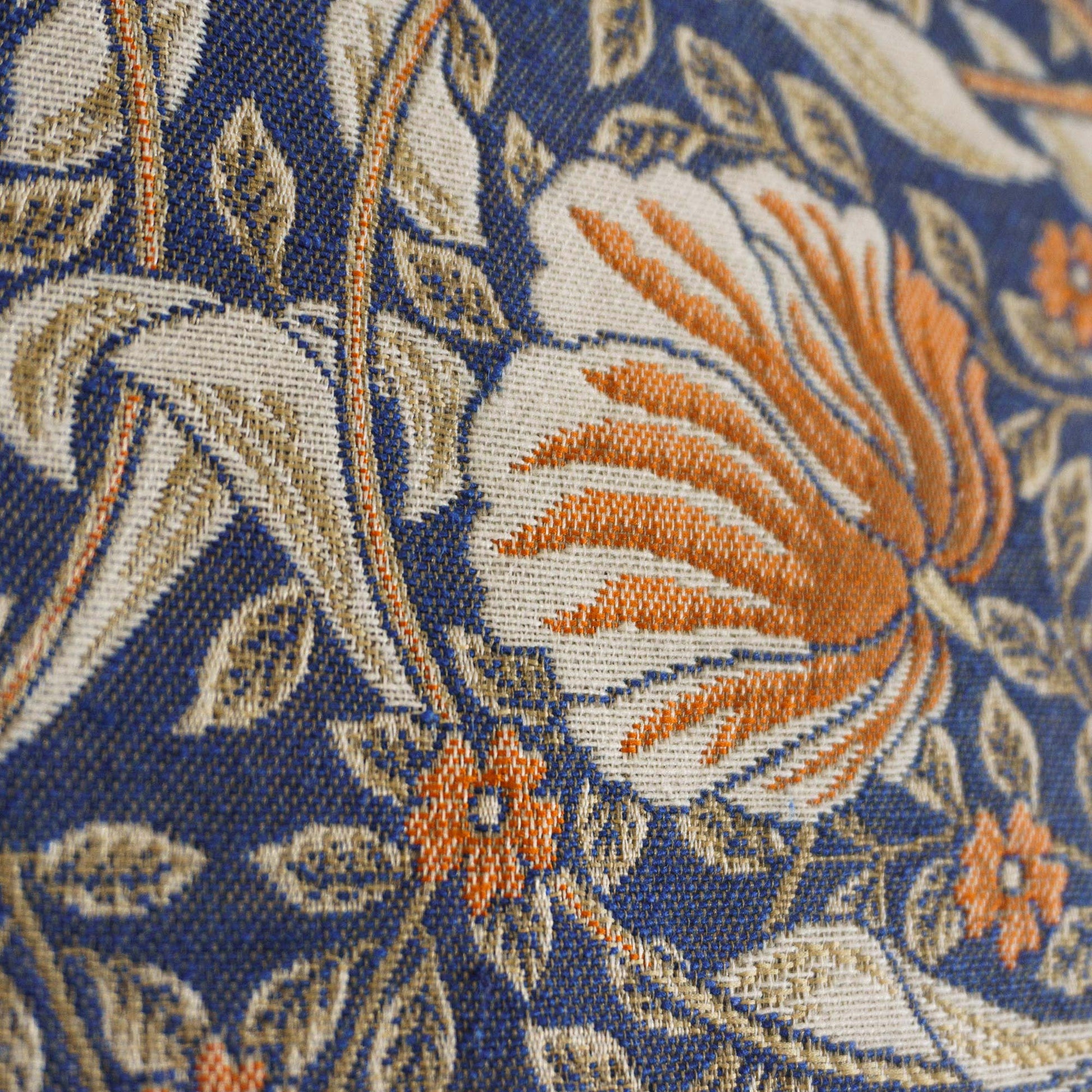 Angled macro of the Pimpernel woven jacquard revealing crisp yarn detail and textured floral motif.