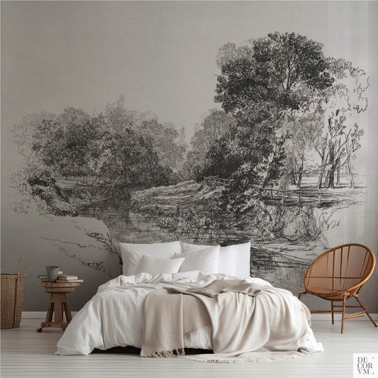 A River in Ireland wallpaper mural, black-and-white etching of trees and riverbank behind a neutral bed in a modern bedroom.