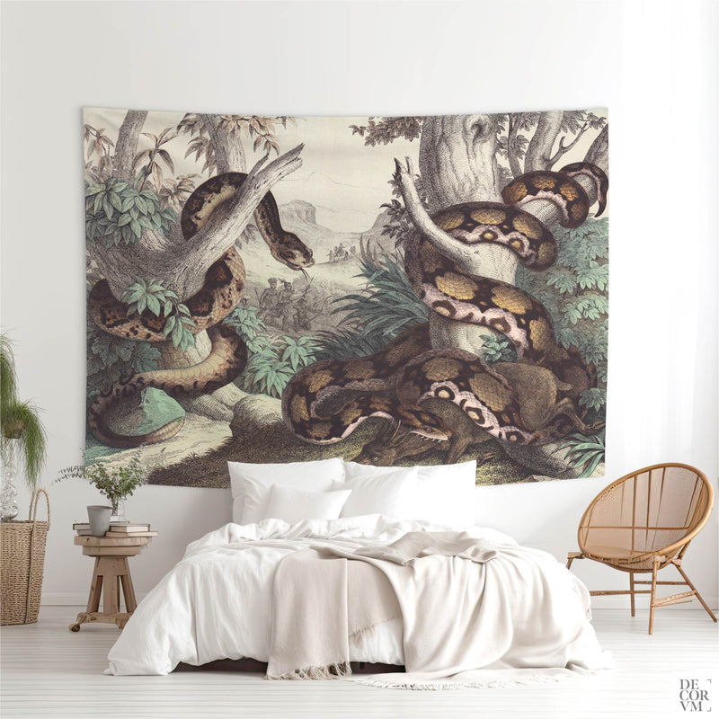 Large Vintage Python natural history wall tapestry hanging above a white bed in an airy bohemian bedroom — coiled snake in lush foliage.