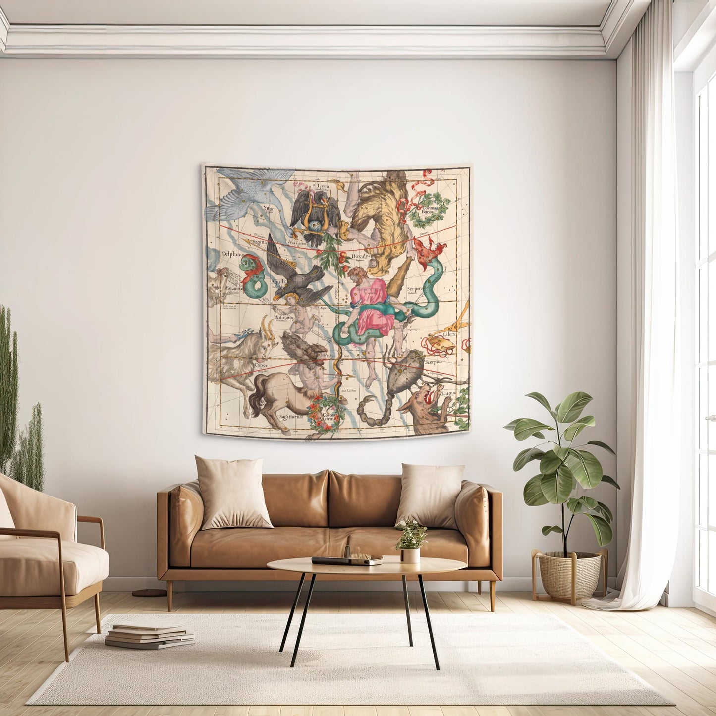 Hercules and Sagittarius constellation wall tapestry hanging above a tan leather sofa in a dark academia living room.