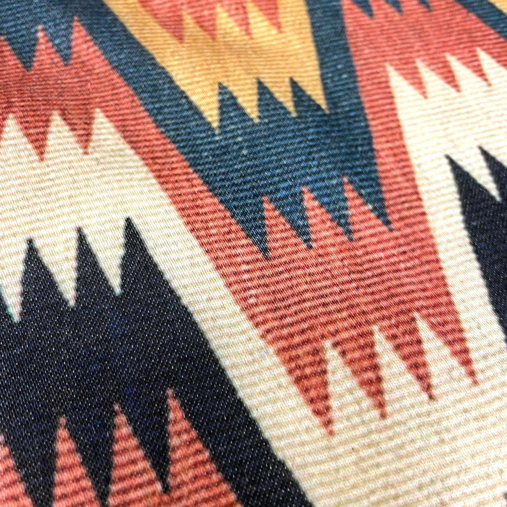 Macro of the cotton-polyester weave — design detail of the 19th-century Swedish Lightning with Cross Border motif.
