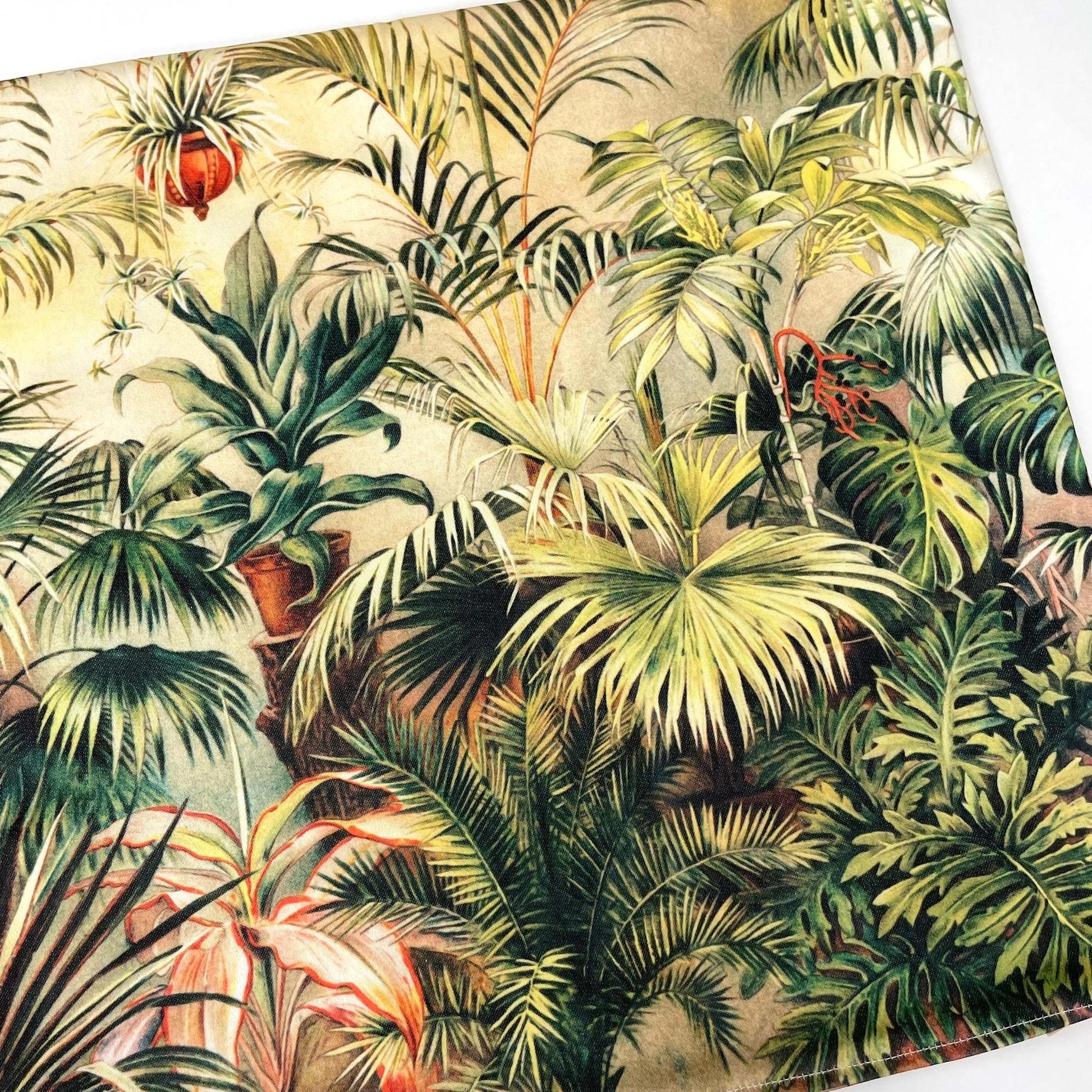 Flat lay of the Victorian conservatory botanical pillow cover showing the layered ferns and exotic foliage.