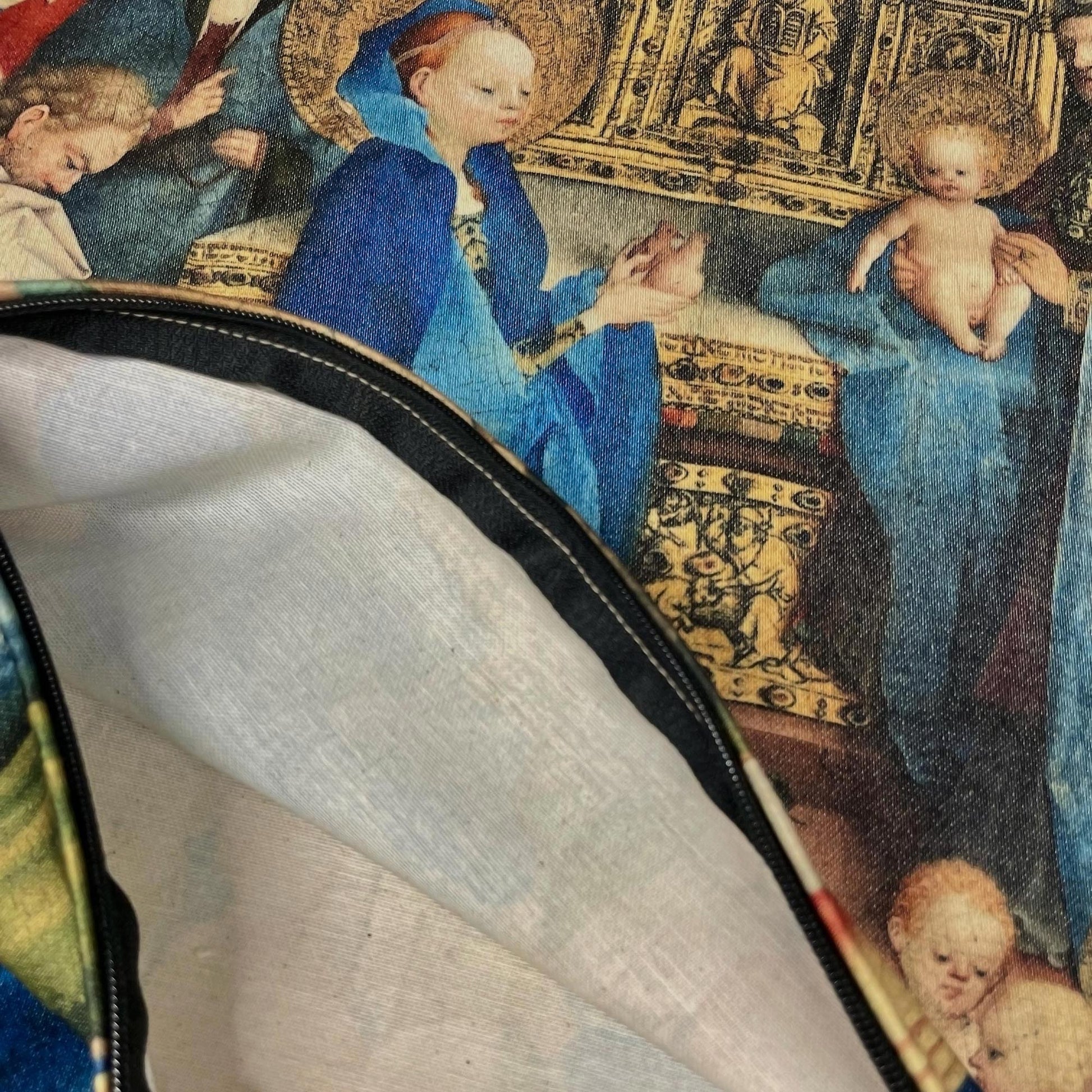 Inside view of the medieval Virgin Mary cushion cover showing the inner lining and black zipper.