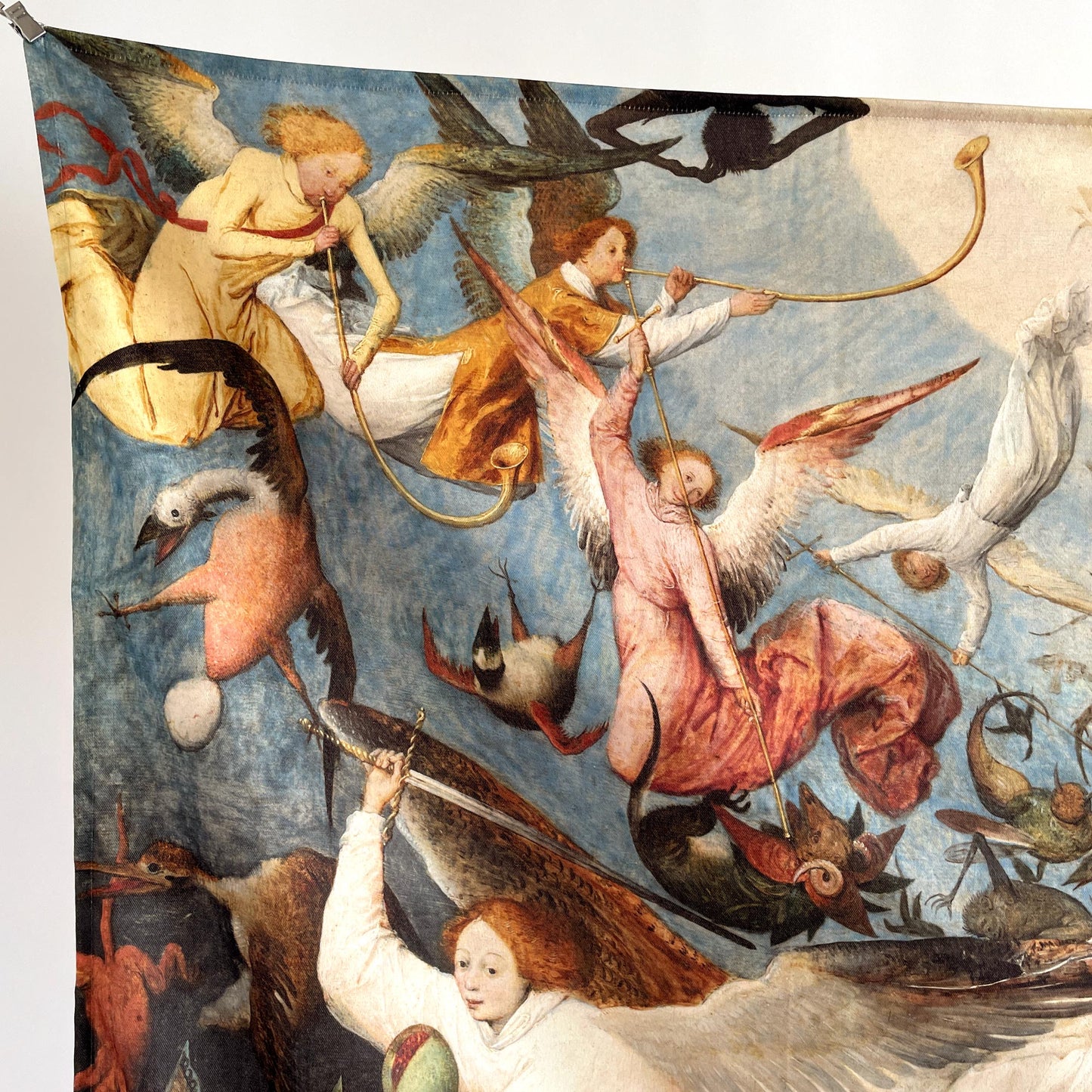 Close-up of angels in flowing robes playing long trumpets — upper-left design detail from Bruegel's Fall of the Rebel Angels.
