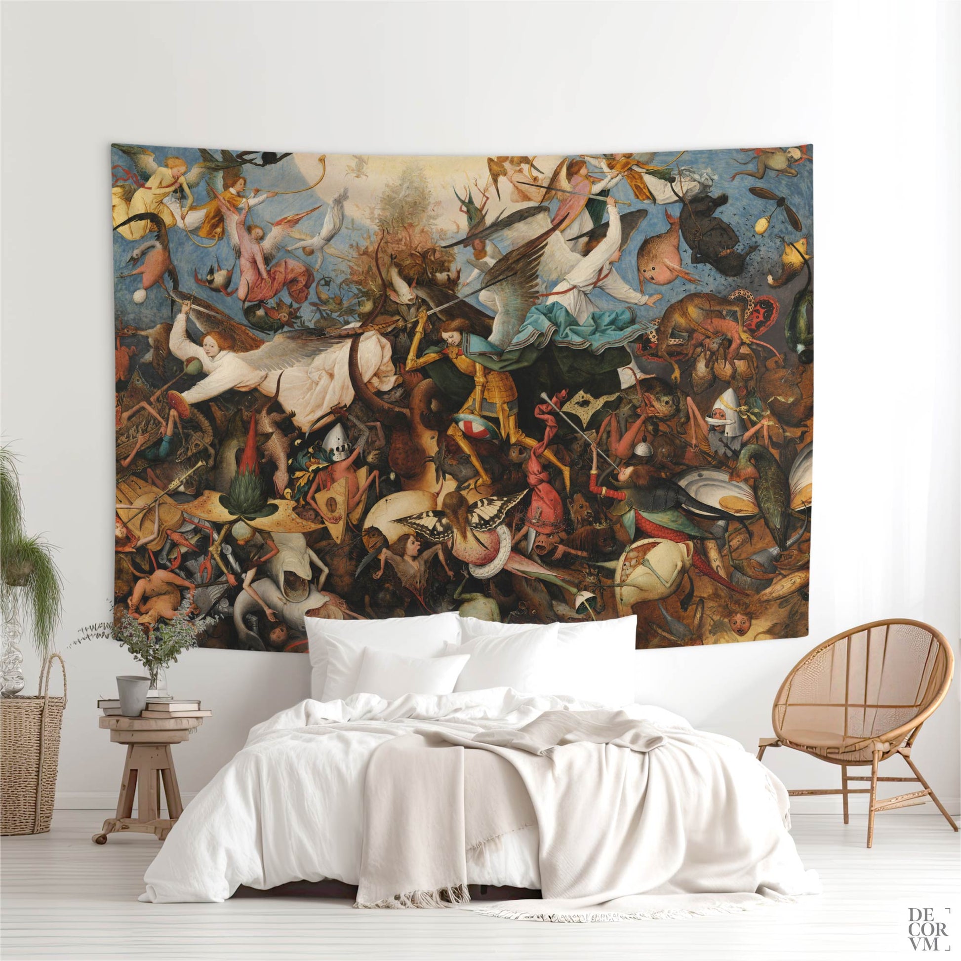 Large Bruegel Fall of the Rebel Angels wall tapestry above a white bed in a bohemian bedroom with a wicker accent chair.