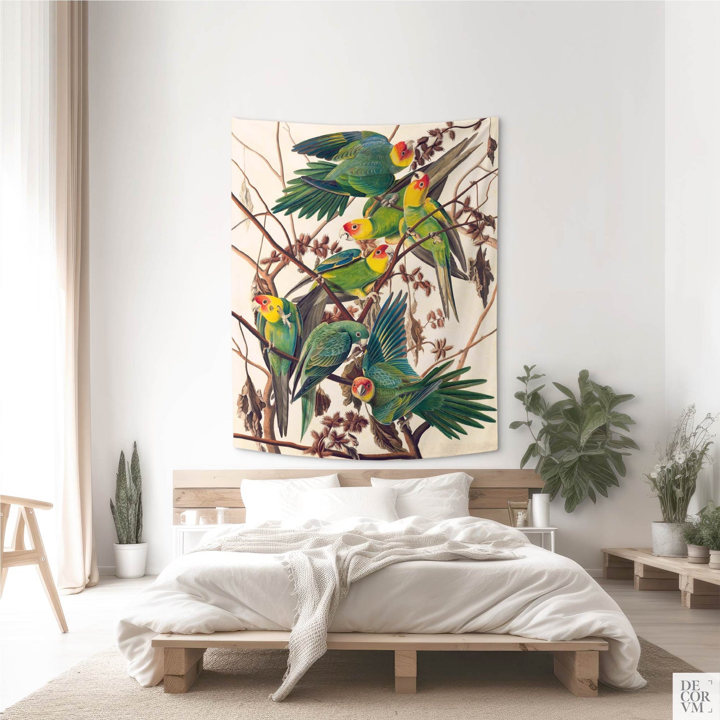 Audubon Carolina Parakeet wall tapestry above a minimalist wooden bed in a bright, airy bedroom by Decorvm.