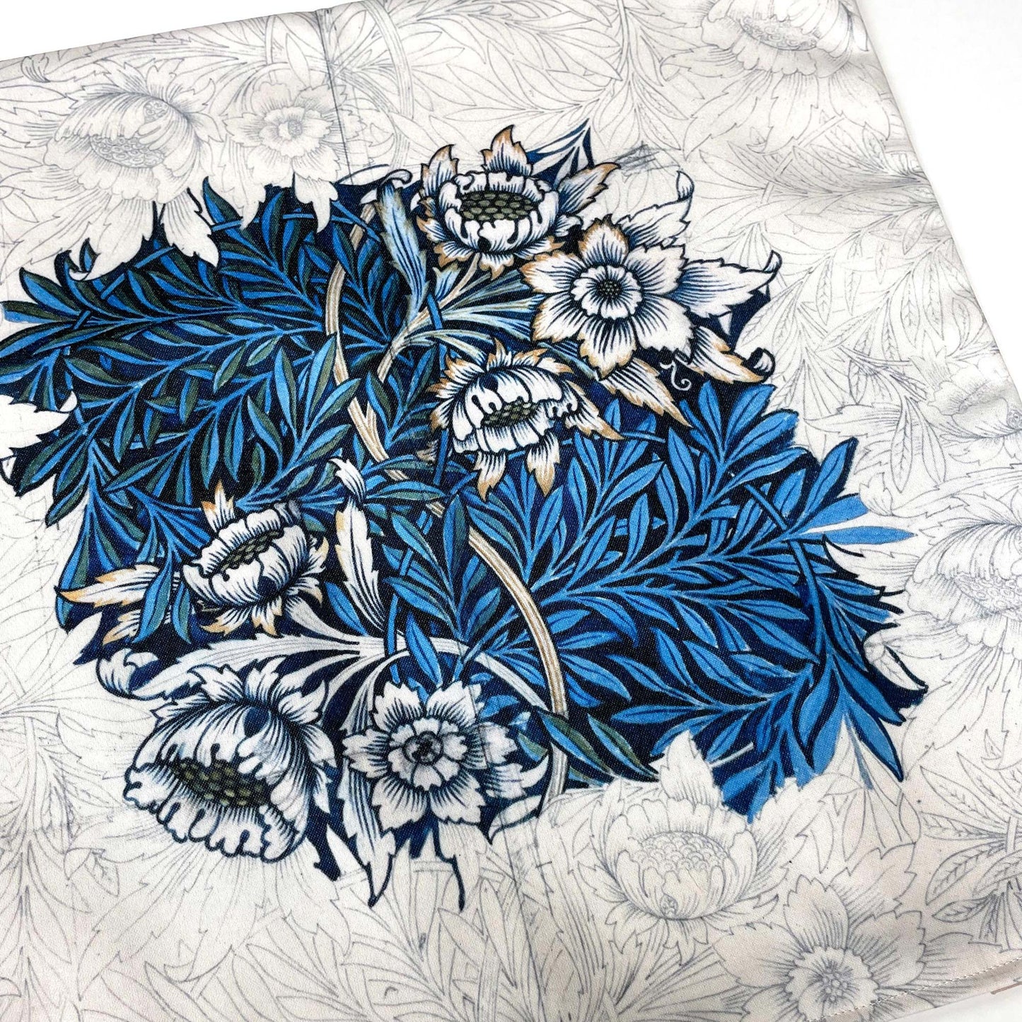 Flat lay of the William Morris Tulip and Willow pillow cover showing the cobalt foliage and white floral pattern.