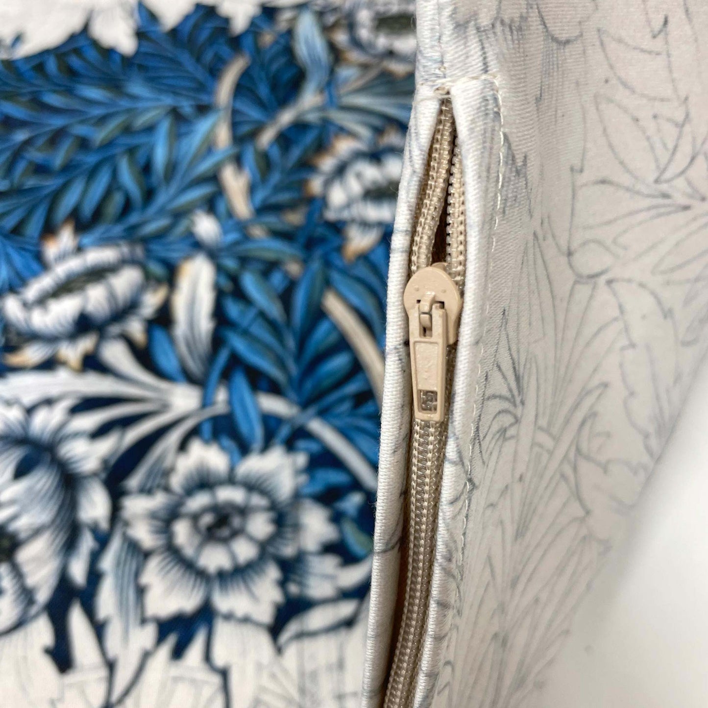 Close-up of the hidden zipper closure on the William Morris Tulip and Willow pillow cover.
