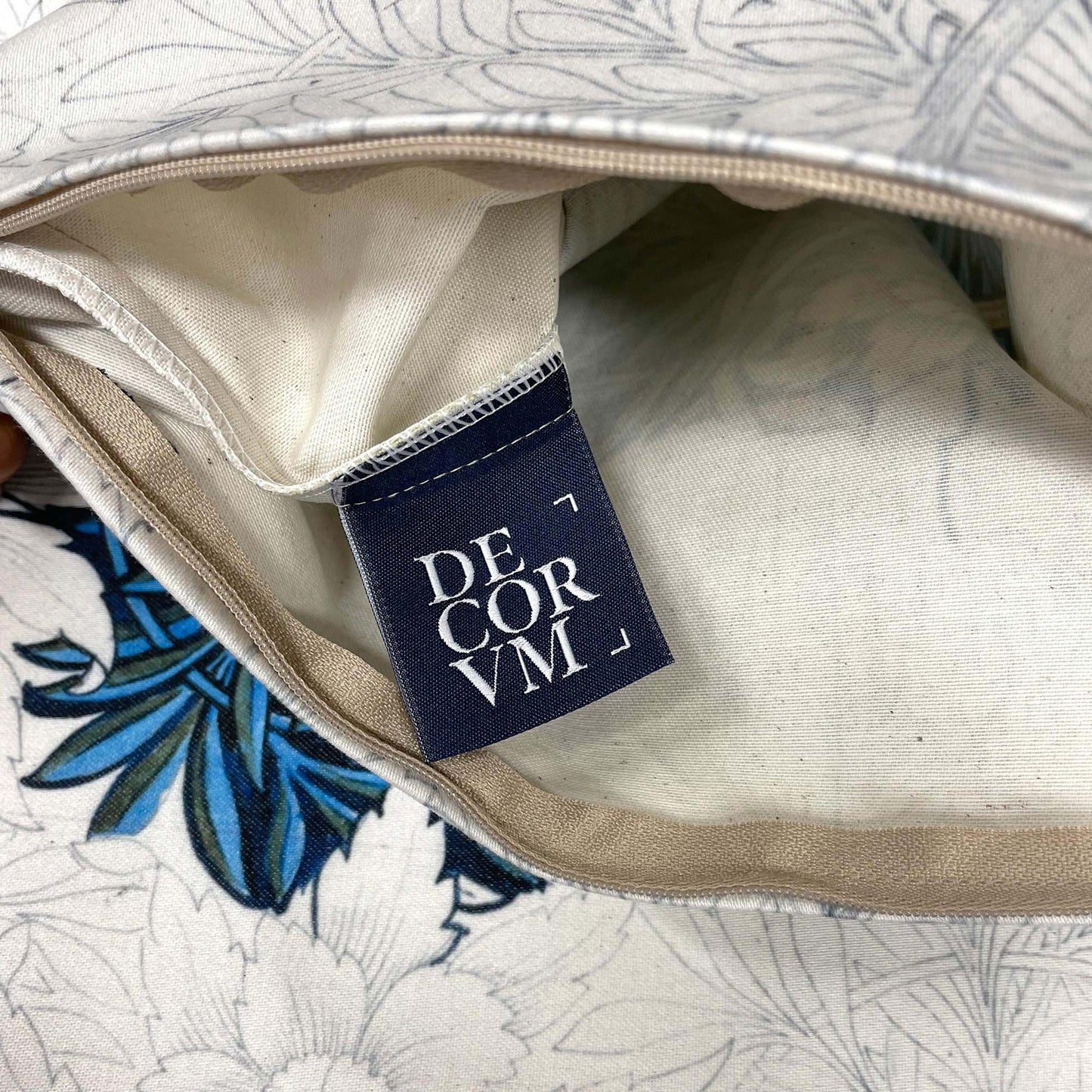 Open zipper view of the Tulip and Willow pillow cover showing the inner lining and Decorvm brand tag.