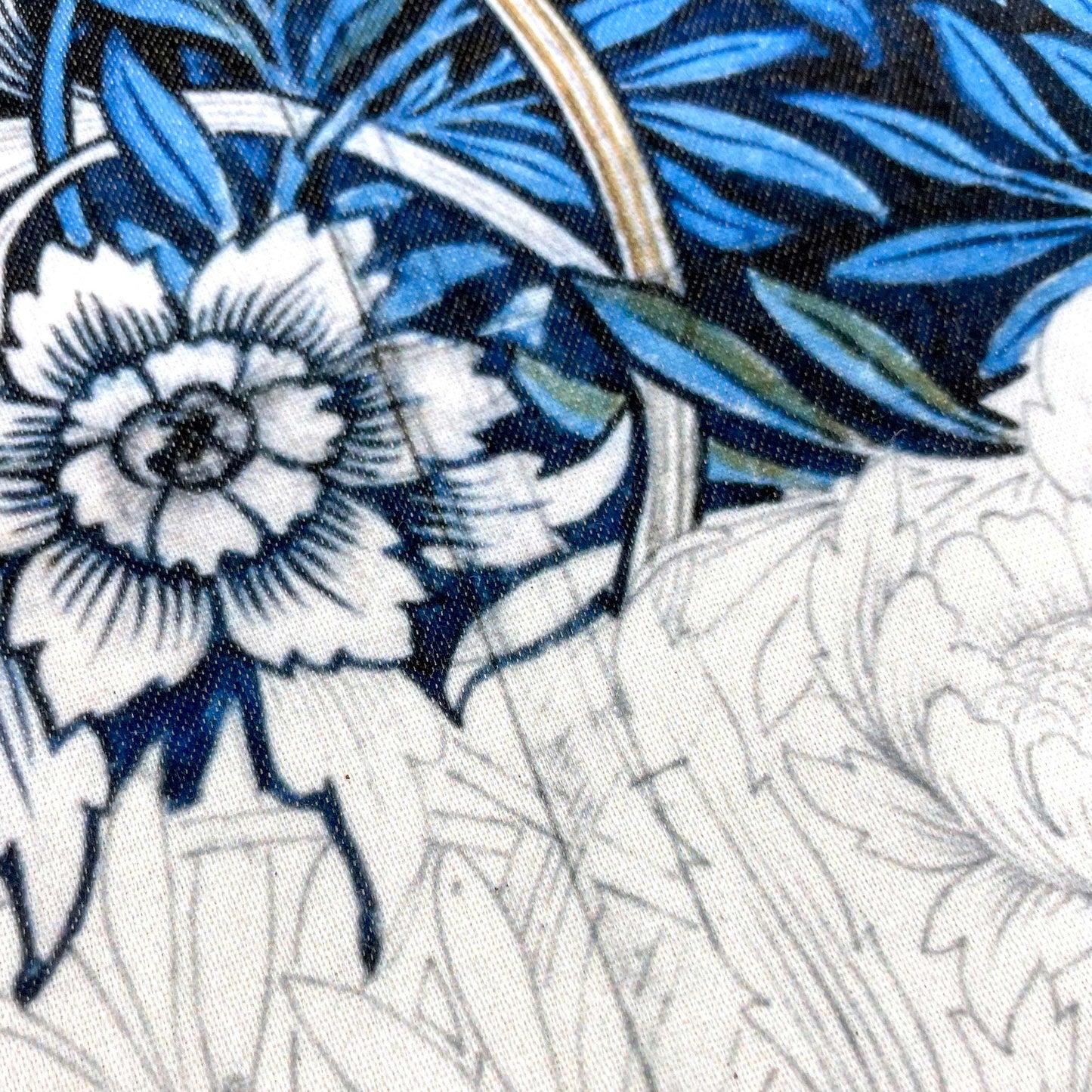 Close-up of a tulip bud and cobalt willow foliage — design detail from William Morris's 1873 Tulip and Willow pattern.