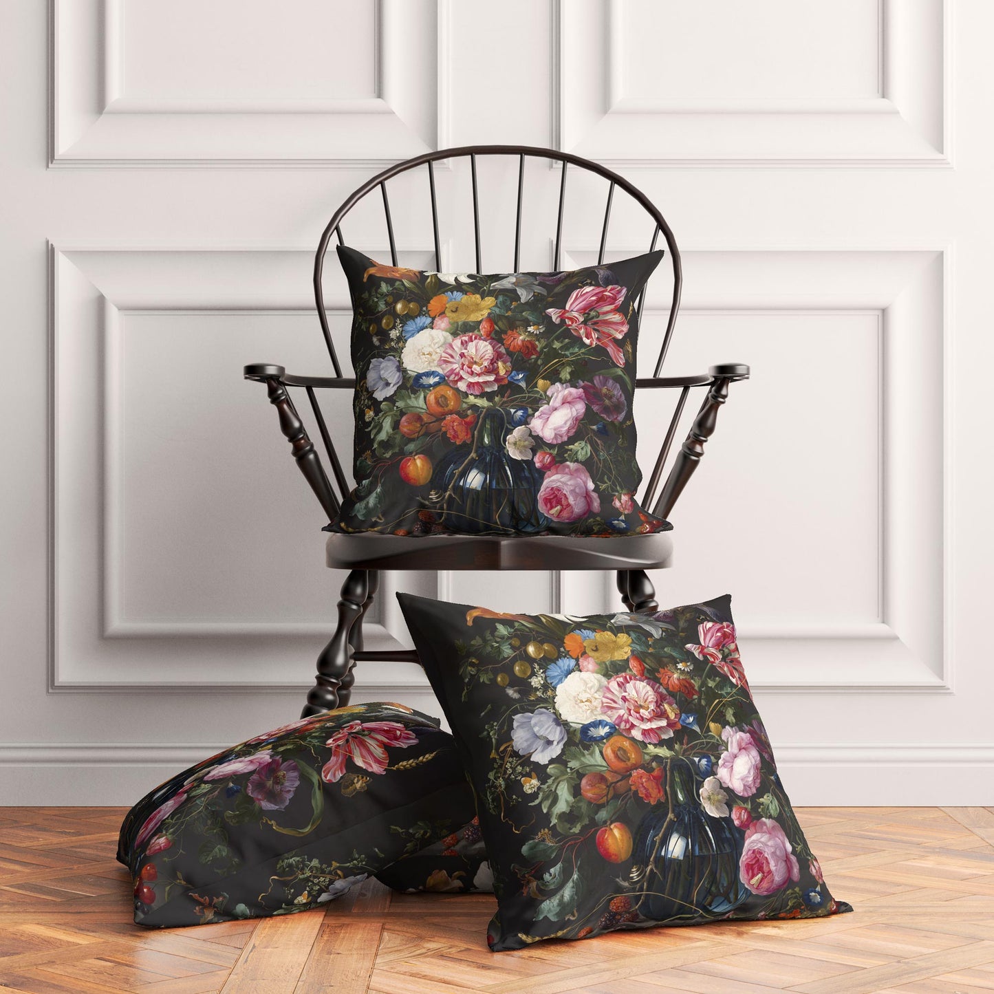 Three Dutch Floral cushion covers styled in a traditional living room — one on a black wooden spindle chair, two on the hardwood floor.