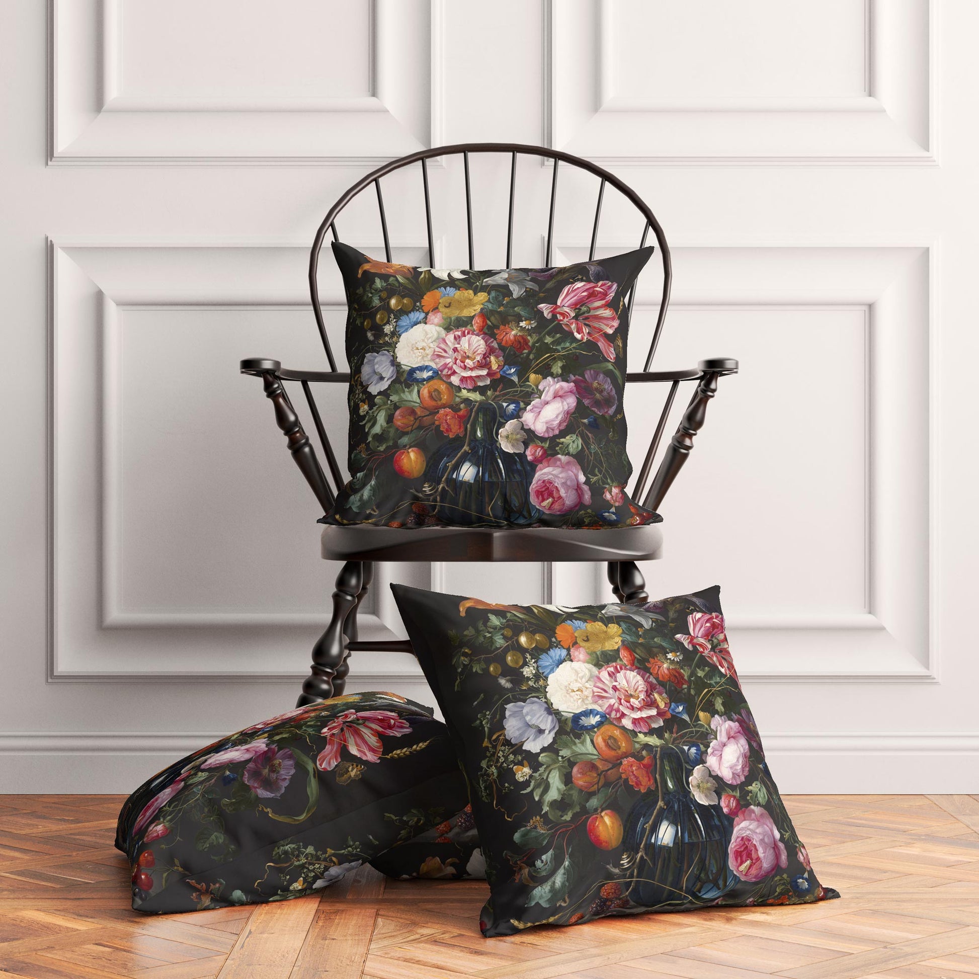 Three Dutch Floral cushion covers styled in a traditional living room — one on a black wooden spindle chair, two on the hardwood floor.