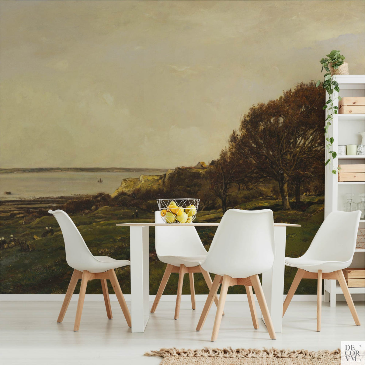 French seaside landscape wallpaper mural in a bright dining room with white table and chairs — vintage coastal painting covering the wall