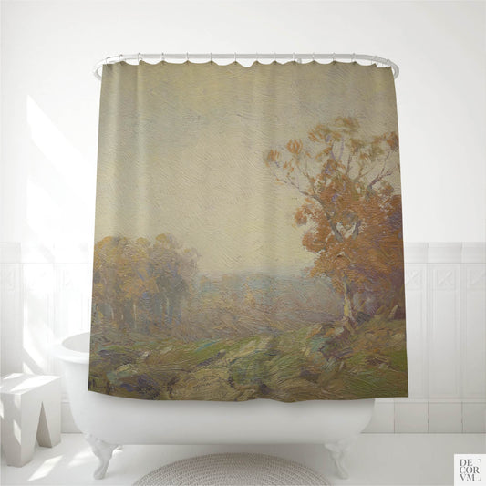 Golden autumn landscape shower curtain hanging on a curved rod over a white clawfoot bathtub in a bright modern bathroom — impressionist painting with golden-orange tree and misty green hills
