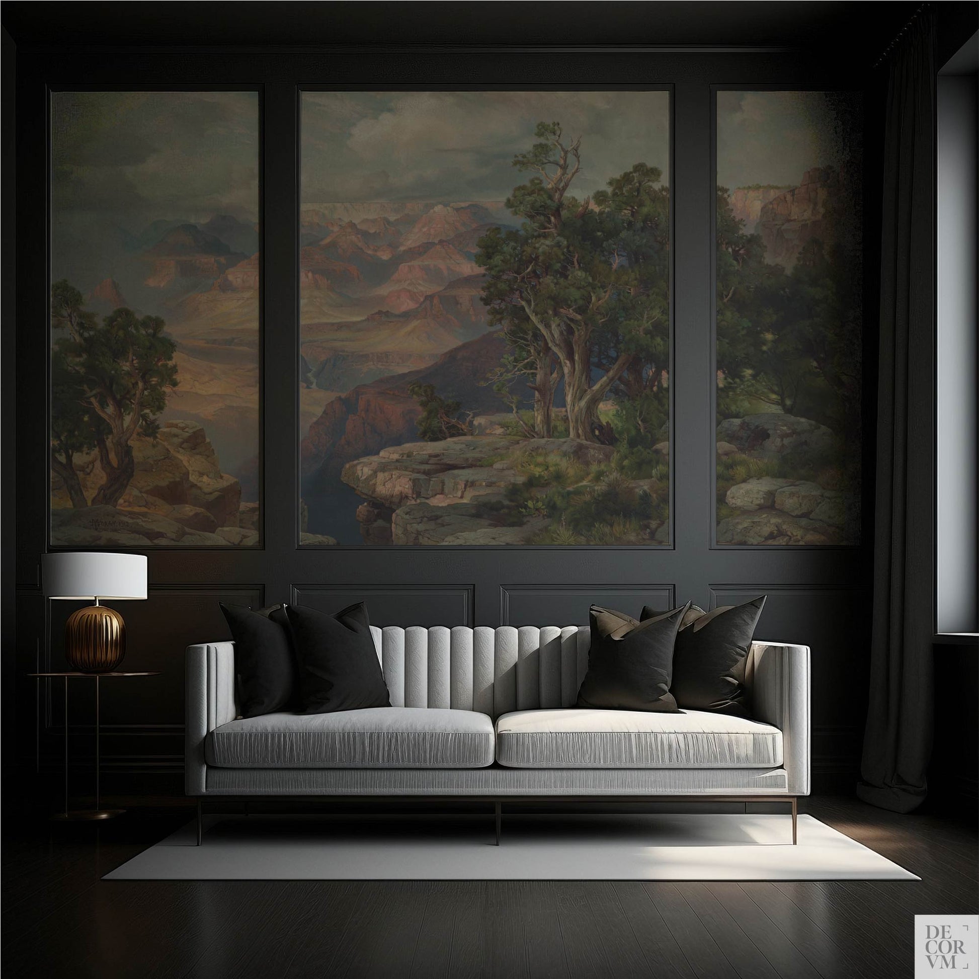 Dramatic grand canyon landscape wallpaper mural framed by dark architectural molding in a sophisticated, moody living room with a white textured couch.