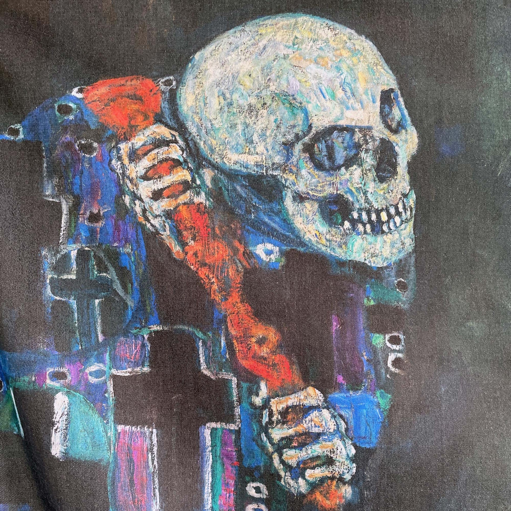 Close-up of the skeletal figure of Death in patterned cross-printed robe — design detail from Gustav Klimt's Death and Life painting.