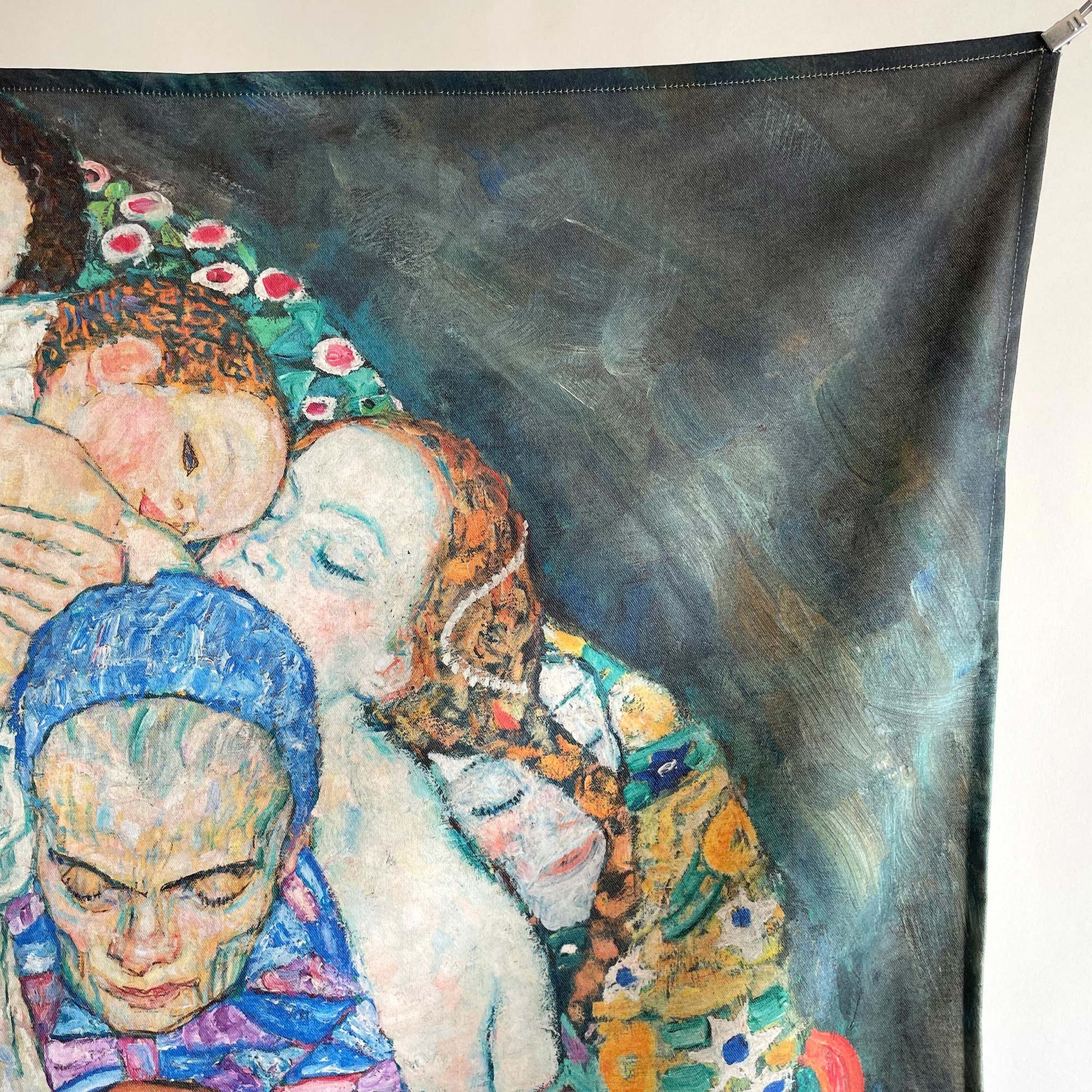 Close-up of the upper portion of the cluster of human figures — design detail showing sleeping faces and embracing lovers from Klimt's Death and Life.