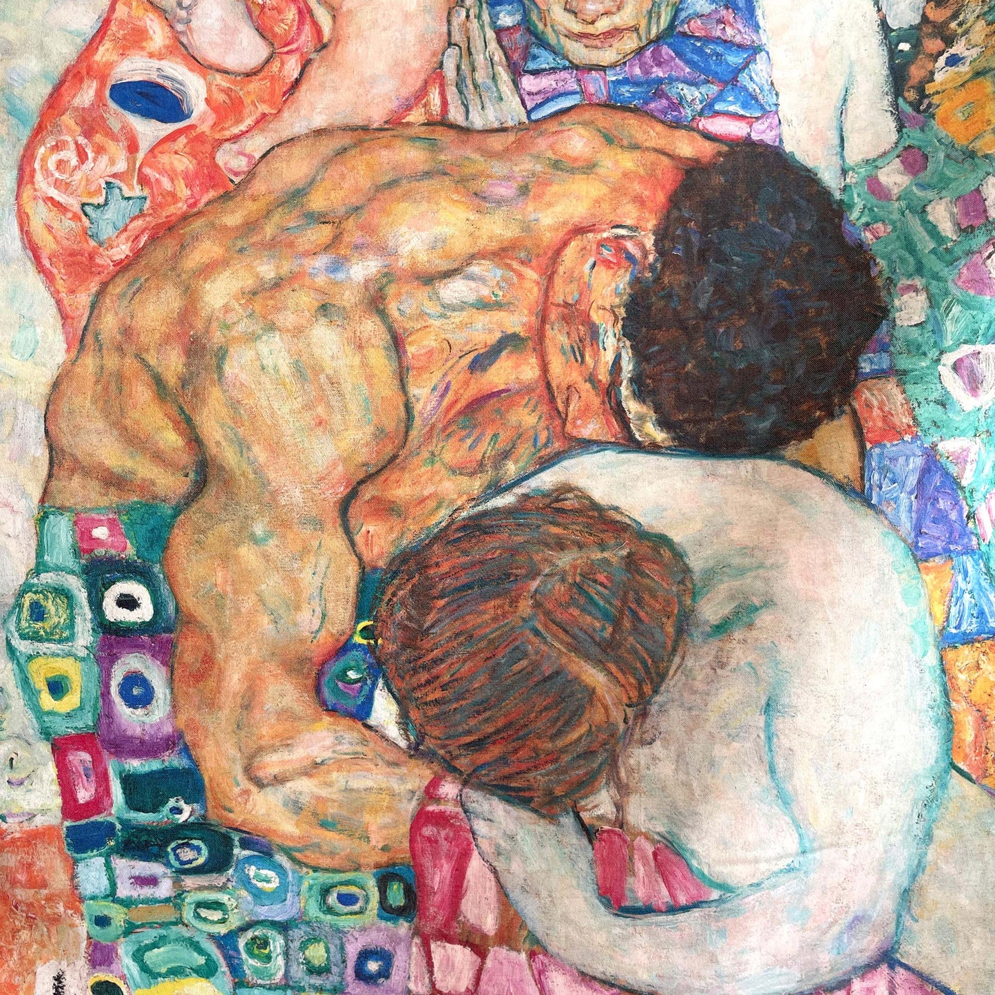 Close-up of the central embrace of the nude figures and surrounding patchwork patterns — design detail from Gustav Klimt's Death and Life painting.
