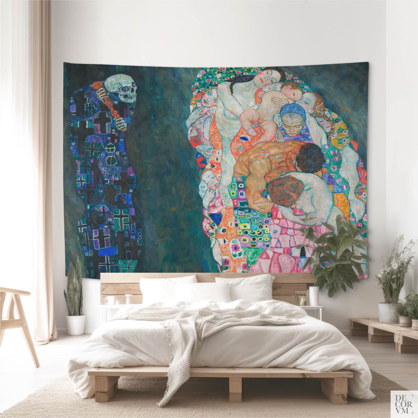 Large Gustav Klimt Death and Life wall tapestry mounted above a natural wood bed in a bright modern bedroom — symbolist statement decor.
