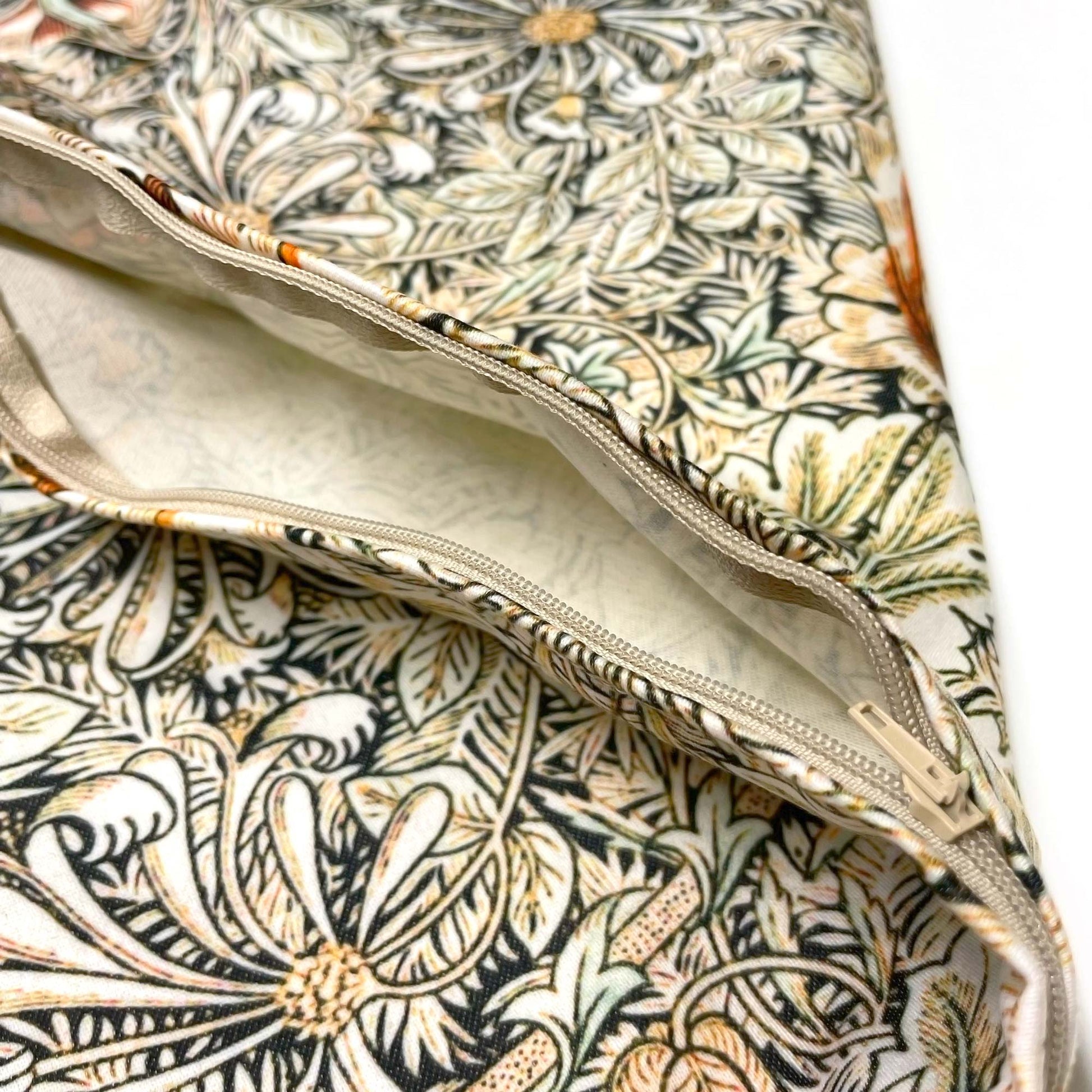 Close-up of the open hidden zipper on the May Morris Honeysuckle pillow cover.