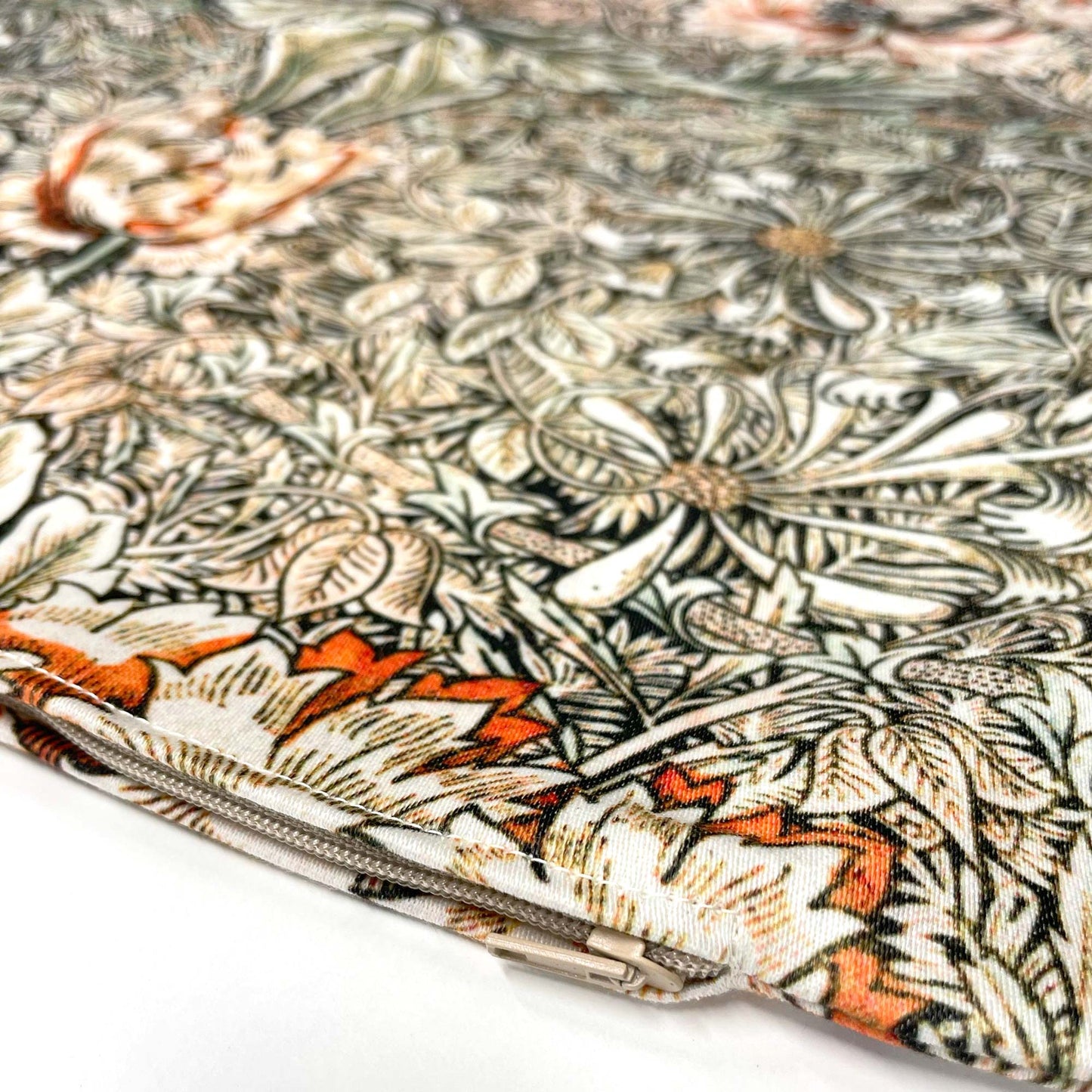 Corner detail of the May Morris Honeysuckle pillow cover showing seam stitching and concealed zipper.